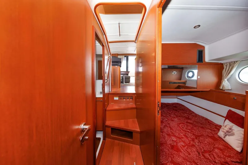 Gotali Yacht Photos Pics Interior of 2016 Beneteau Swift Trawler 44, featuring wood paneling and cozy cabin space.