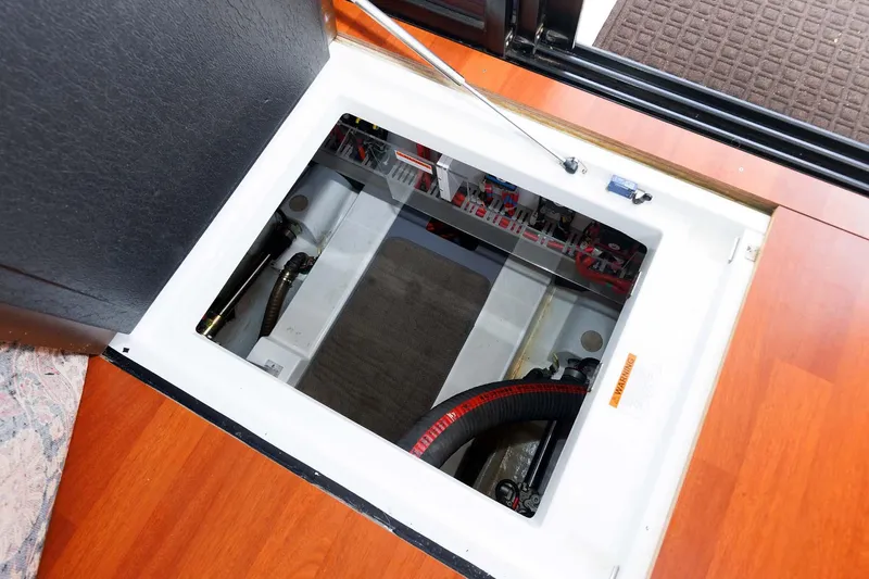 Gotali Yacht Photos Pics Engine compartment of 2016 Beneteau Swift Trawler 44 with open hatch and visible components.