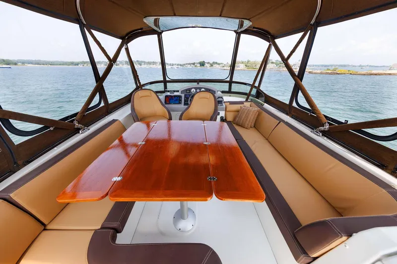 Gotali Yacht Photos Pics 2016 Beneteau Swift Trawler 44 interior with elegant seating and wooden table.