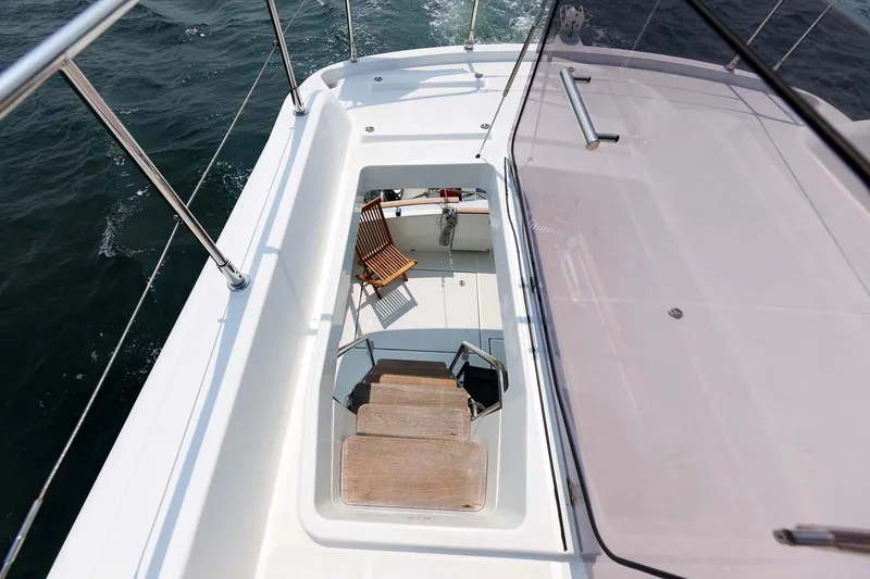 Gotali Yacht Photos Pics 2016 Beneteau Swift Trawler 44 deck with stairs and seating area.