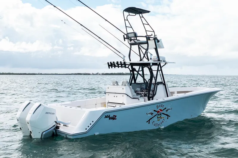  Yacht Photos Pics Futuristic SeeVee 32 boat on water, featuring dual Mercury engines, 2099 model.