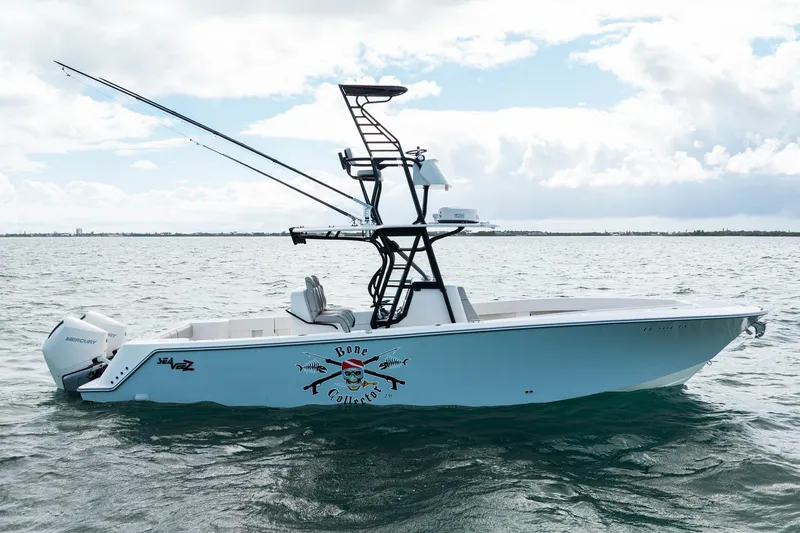  Yacht Photos Pics Futuristic SeeVee 32 boat on water, featuring advanced design and Mercury engines.