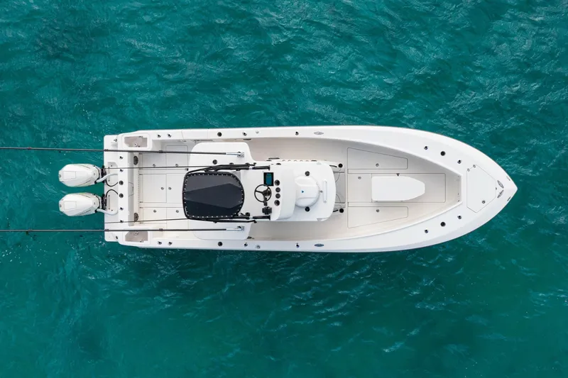  Yacht Photos Pics Overhead view of a 2099 SeeVee 32 boat on turquoise water.