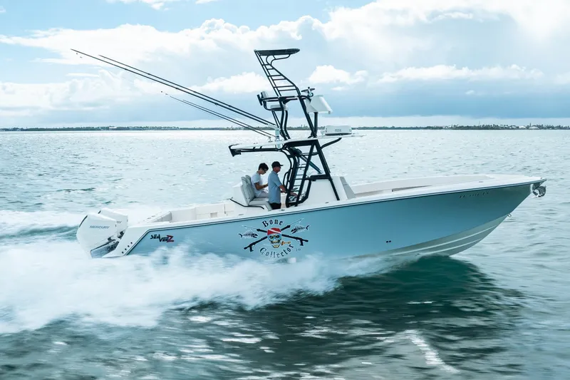  Yacht Photos Pics High-speed SeeVee 32 boat cruising on open water, 2099 model.