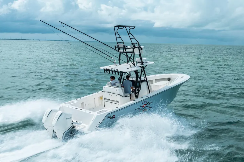  Yacht Photos Pics SeeVee 32 boat cruising on open water, 2099 model, with dual outboard engines.