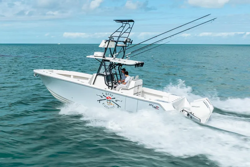  Yacht Photos Pics High-speed SeeVee 32 boat cruising on ocean, 2099 model, with fishing rods and clear skies.