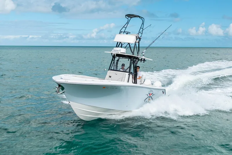  Yacht Photos Pics SeeVee 32 boat cruising on open water, 2099 model, under clear blue skies.