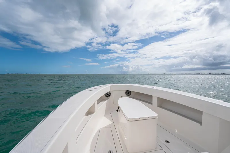  Yacht Photos Pics SeeVee 32 boat on open water under a partly cloudy sky, year 2099.