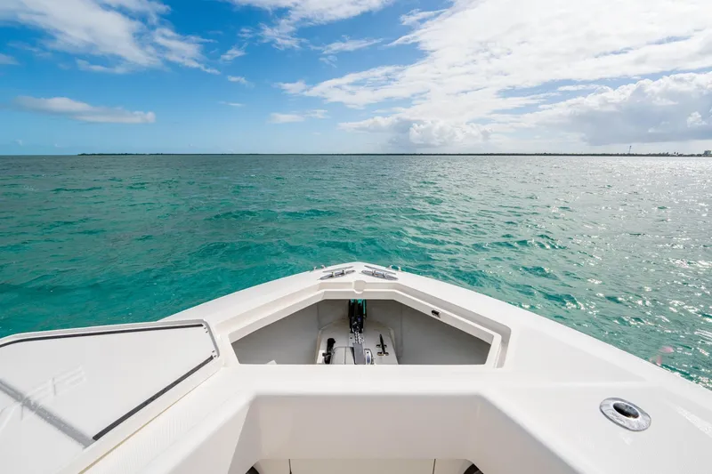  Yacht Photos Pics Bow view of SeeVee 32 boat on turquoise ocean under blue sky, year 2099.