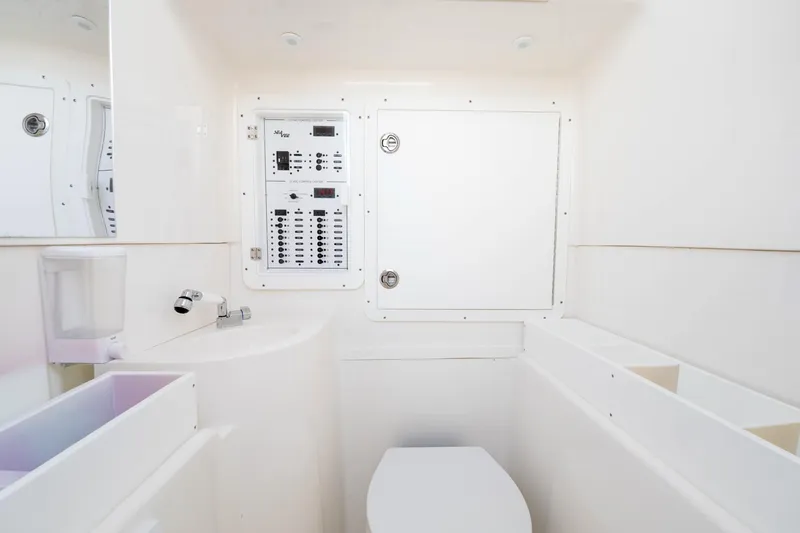  Yacht Photos Pics Modern SeeVee 32 boat bathroom with control panel, sleek design, and compact layout, year 2099.