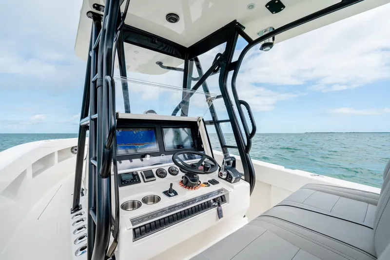  Yacht Photos Pics Modern SeeVee 32 boat cockpit with advanced navigation system, ocean view, 2099 model.