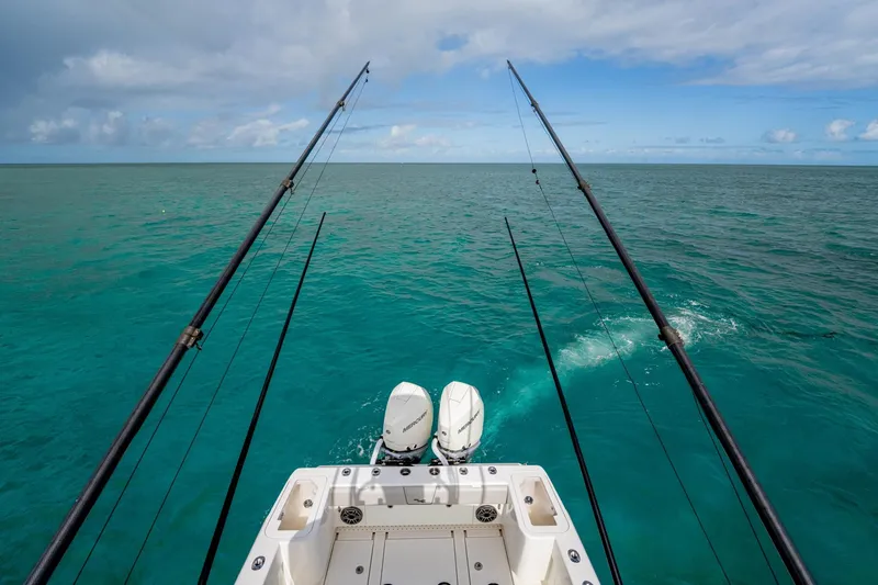  Yacht Photos Pics Fishing rods on a SeeVee 32 boat, 2099 model, in clear turquoise ocean.