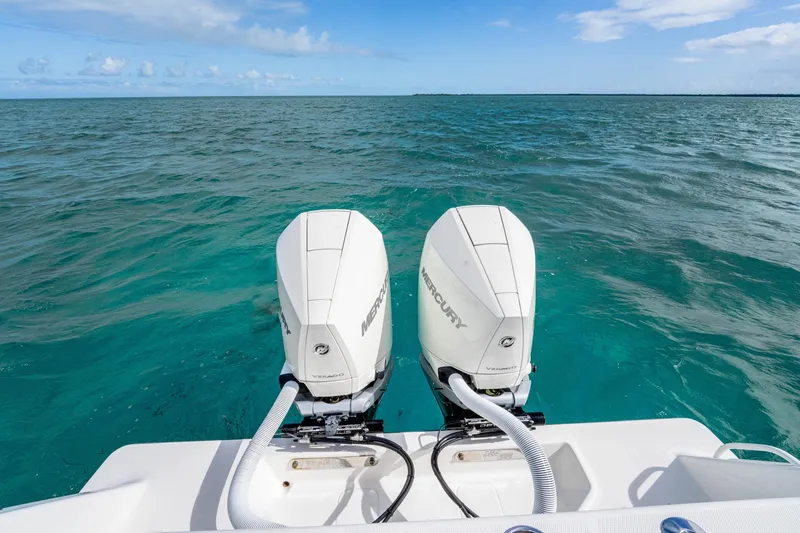  Yacht Photos Pics Twin Mercury outboard engines on a SeeVee 32 boat, 2099 model, in clear blue ocean.