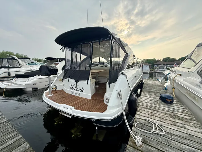  Yacht Photos Pics 2013 Beneteau Gran Turismo 34 docked at marina, rear view with canopy.