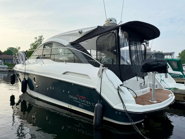  Yacht Photos Pics 2013 Beneteau Gran Turismo 34 yacht docked at marina, rear view.