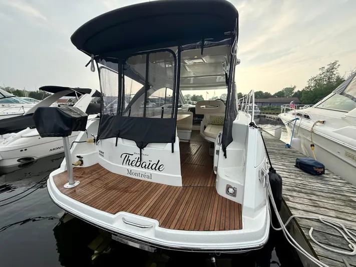  Yacht Photos Pics 2013 Beneteau Gran Turismo 34 yacht docked, featuring a covered deck and elegant design.