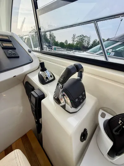  Yacht Photos Pics 2013 Beneteau Gran Turismo 34 helm with modern controls and navigation equipment.