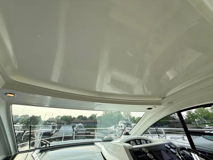  Yacht Photos Pics Interior view of 2013 Beneteau Gran Turismo 34 yacht cockpit with dashboard and windows.