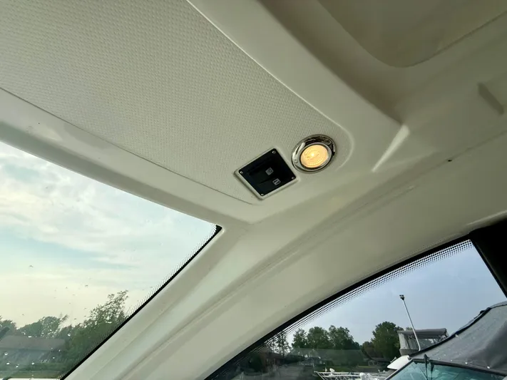  Yacht Photos Pics Ceiling interior of 2013 Beneteau Gran Turismo 34 with light and control panel.