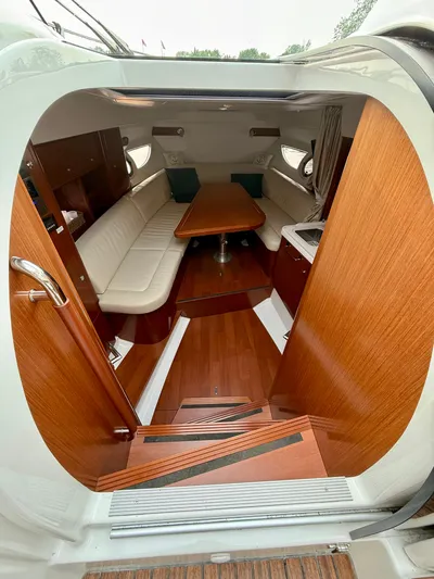  Yacht Photos Pics Interior of 2013 Beneteau Gran Turismo 34 yacht with wood finish and seating area.