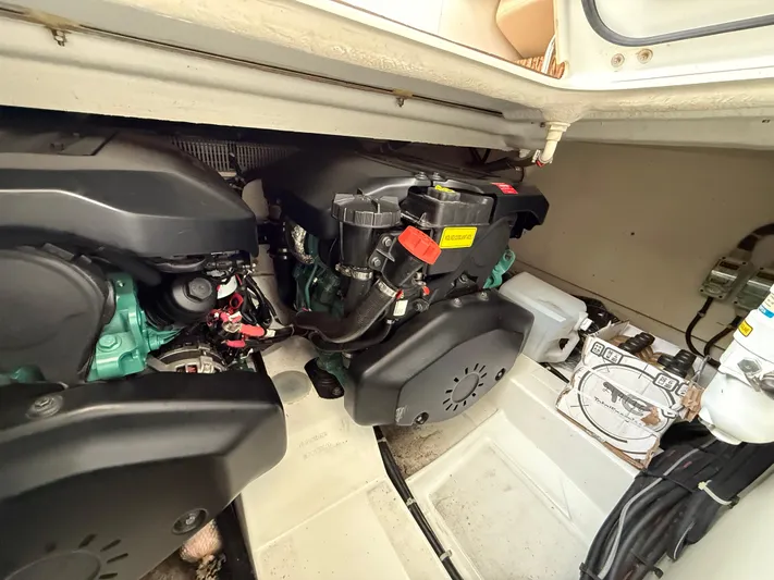  Yacht Photos Pics Engine compartment of 2013 Beneteau Gran Turismo 34, showcasing dual engines and mechanical components.