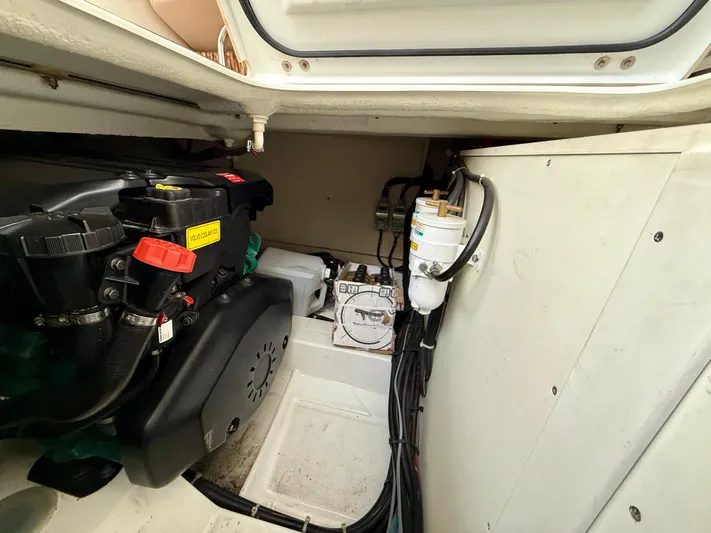  Yacht Photos Pics Engine compartment of 2013 Beneteau Gran Turismo 34, showcasing mechanical components and wiring.