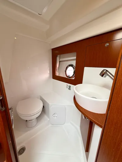 Yacht Photos Pics 2013 Beneteau Gran Turismo 34 bathroom with modern fixtures and wood accents.