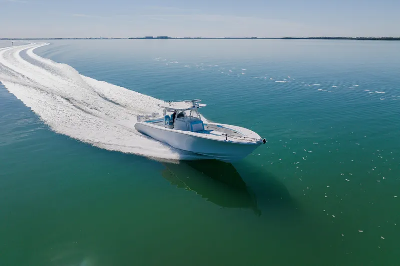  Yacht Photos Pics 2015 Yellowfin 39 Offshore boat cruising on calm, clear waters.