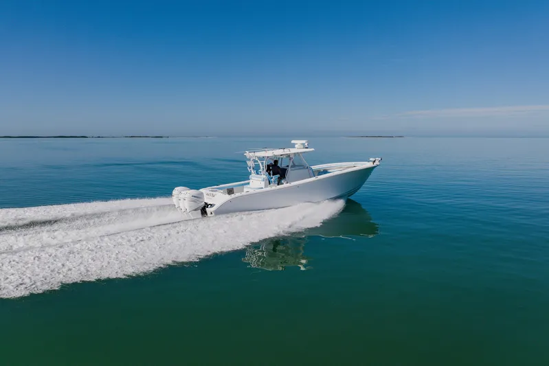  Yacht Photos Pics 2015 Yellowfin 39 Offshore boat cruising on calm blue waters.
