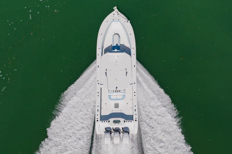  Yacht Photos Pics Aerial view of 2015 Yellowfin 39 Offshore boat cruising on green water.