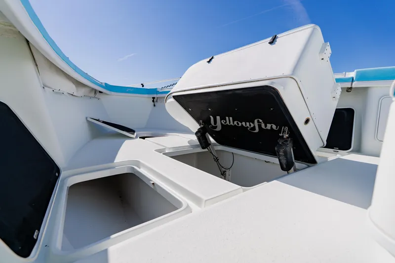  Yacht Photos Pics 2015 Yellowfin 39 Offshore boat interior with open storage compartments under clear blue sky.