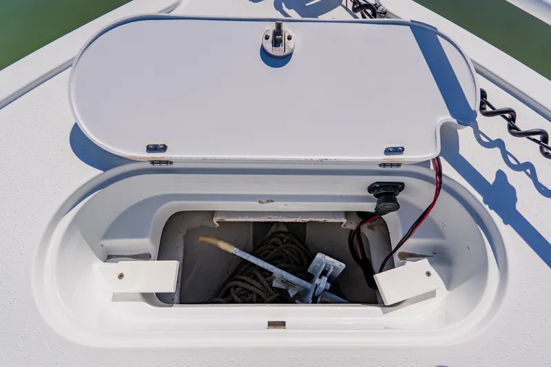  Yacht Photos Pics 2015 Yellowfin 39 Offshore anchor compartment with open hatch and visible rope.