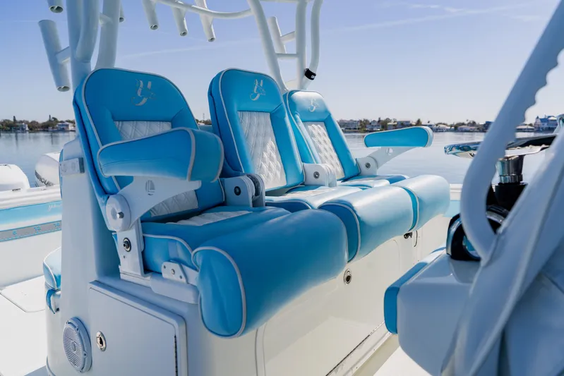  Yacht Photos Pics Luxurious seating on a 2015 Yellowfin 39 Offshore boat with blue and white upholstery.