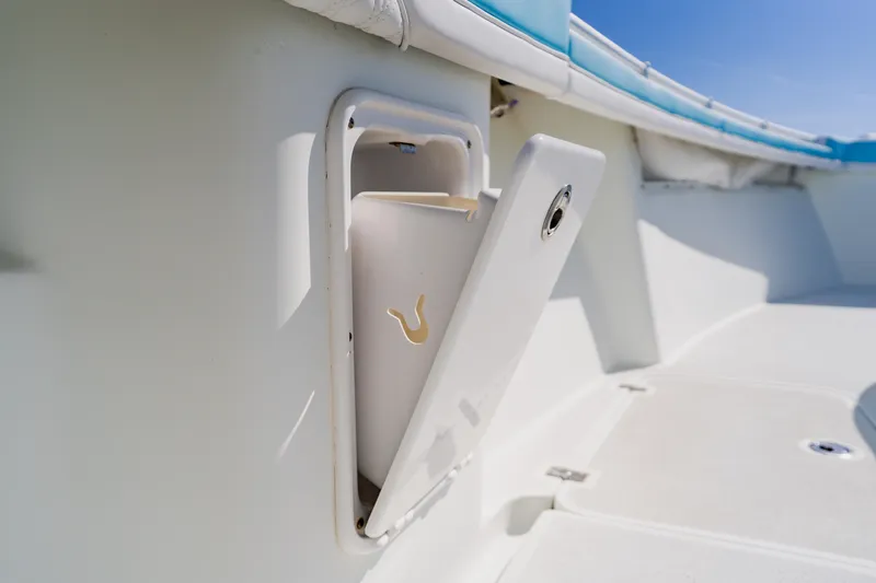  Yacht Photos Pics 2015 Yellowfin 39 Offshore boat compartment with open hatch, showcasing interior storage.