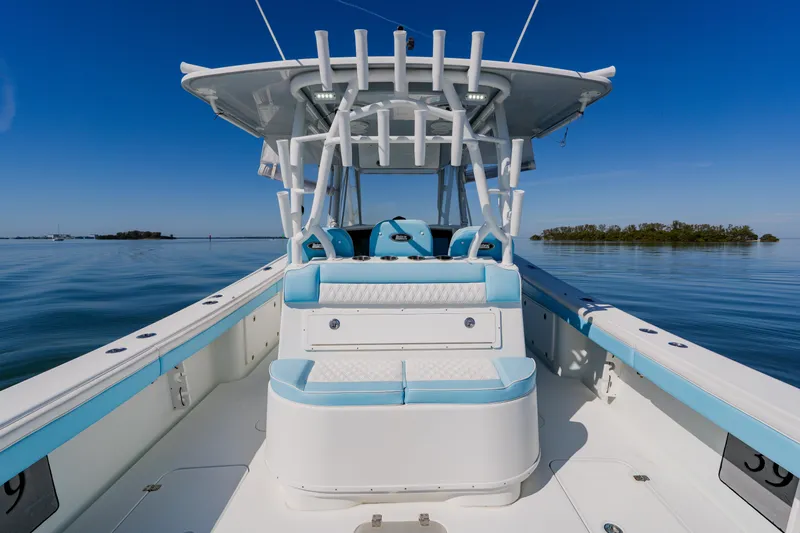  Yacht Photos Pics 2015 Yellowfin 39 Offshore boat on calm water, featuring sleek design and spacious deck.