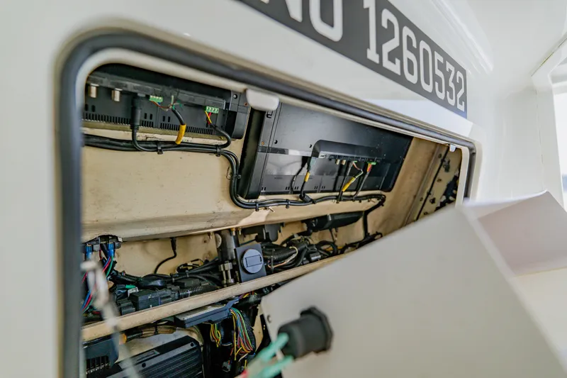  Yacht Photos Pics 2015 Yellowfin 39 Offshore boat electrical compartment with wiring and components visible.