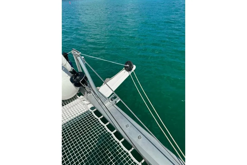 Honu Kai Yacht Photos Pics 2023 Fountaine Pajot Catamaran Astrea 42, deck view over turquoise water.