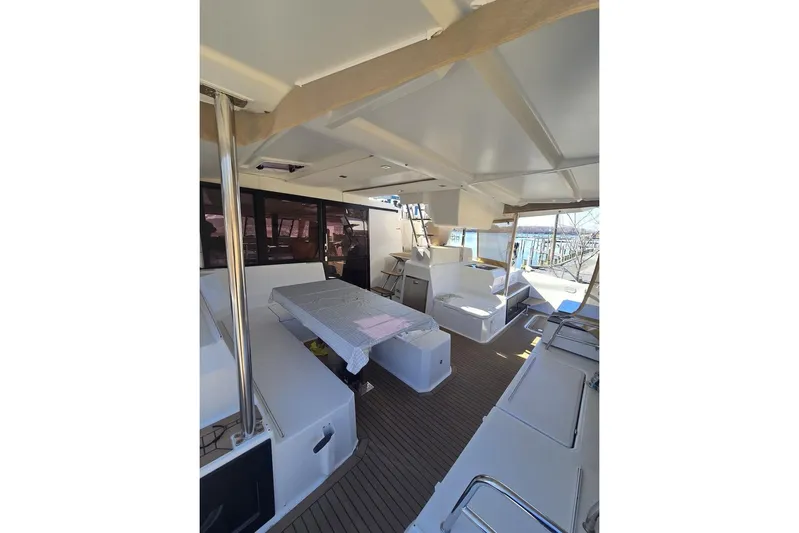 Honu Kai Yacht Photos Pics 2023 Fountaine Pajot Catamaran Astrea 42 interior with spacious seating and modern design.