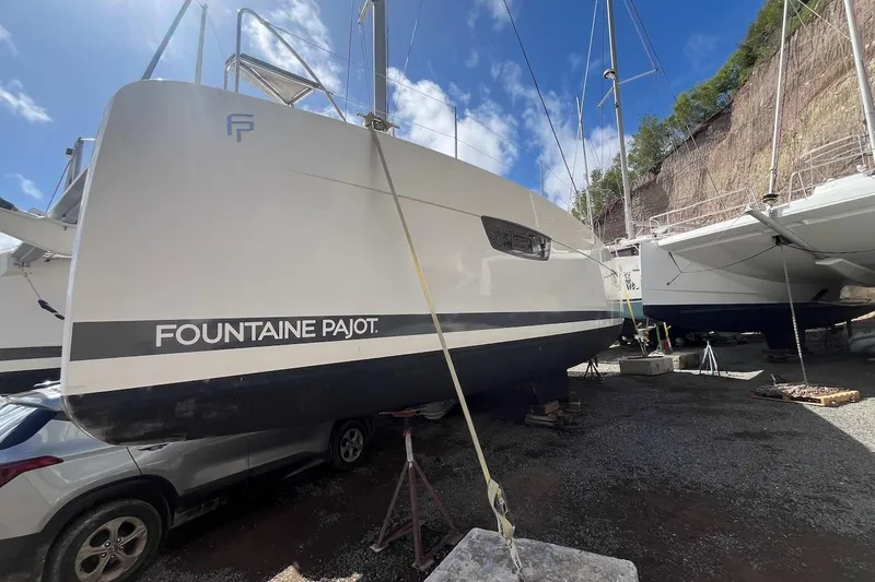 Honu Kai Yacht Photos Pics 2023 Fountaine Pajot Catamaran Astrea 42 on dry dock, side view.