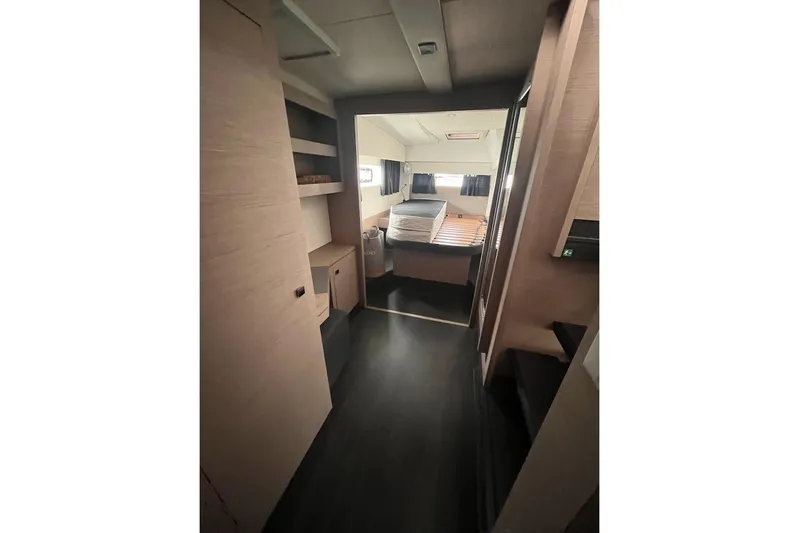 Honu Kai Yacht Photos Pics 2023 Fountaine Pajot Catamaran Astrea 42 interior cabin with modern design and ample storage.