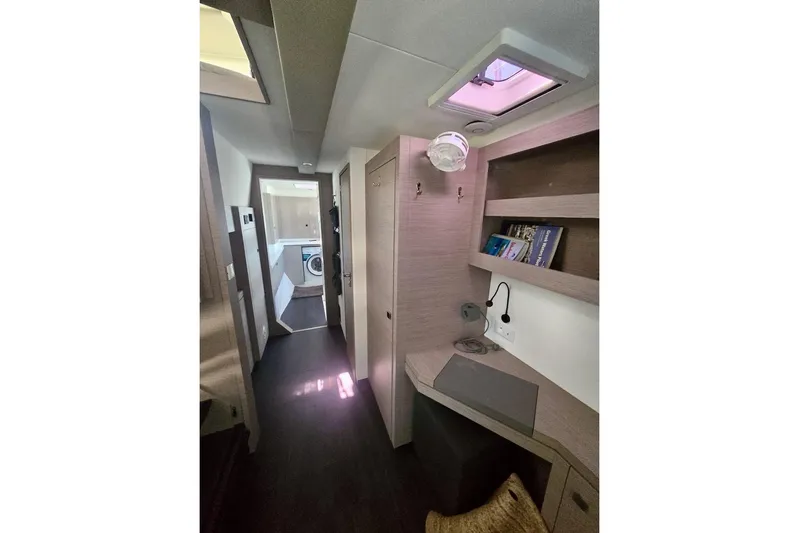 Honu Kai Yacht Photos Pics Interior of 2023 Fountaine Pajot Catamaran Astrea 42 with modern design and built-in desk.