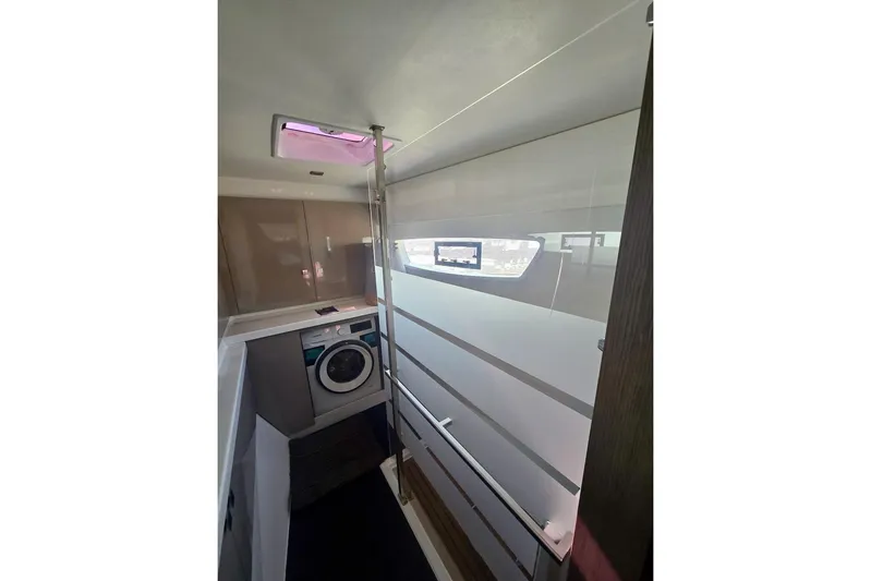Honu Kai Yacht Photos Pics Interior of 2023 Fountaine Pajot Catamaran Astrea 42 with modern laundry area.