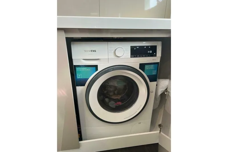 Honu Kai Yacht Photos Pics Siemens washing machine installed in a modern kitchen on a 2023 Fountaine Pajot Catamaran Astrea 42.