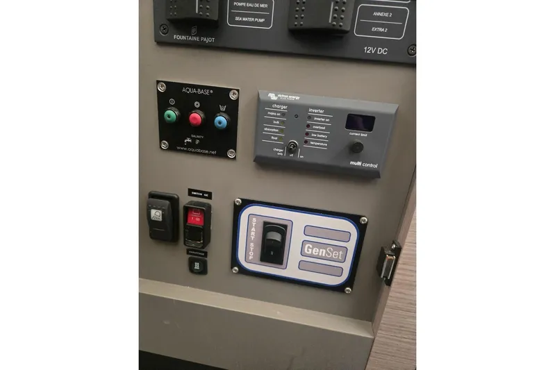 Honu Kai Yacht Photos Pics Control panel of 2023 Fountaine Pajot Catamaran Astrea 42 with various switches and indicators.