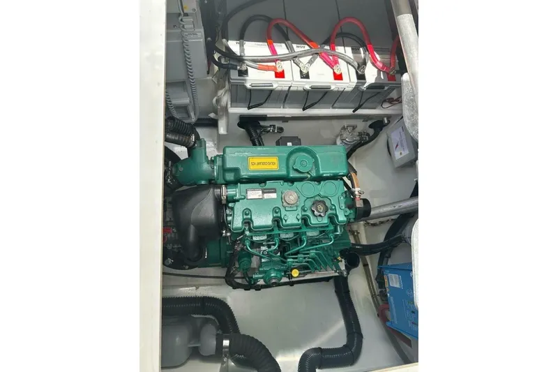 Honu Kai Yacht Photos Pics Engine compartment of 2023 Fountaine Pajot Catamaran Astrea 42 with visible batteries and wiring.