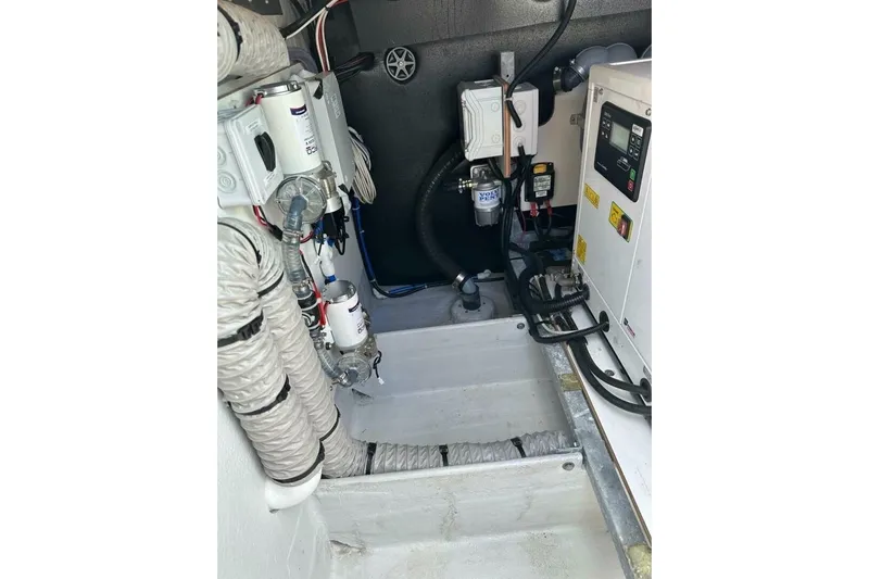 Honu Kai Yacht Photos Pics Engine room of 2023 Fountaine Pajot Catamaran Astrea 42, showcasing mechanical components.