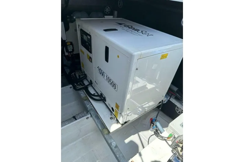 Honu Kai Yacht Photos Pics Generator inside 2023 Fountaine Pajot Catamaran Astrea 42, model GVI 10500, in engine compartment.