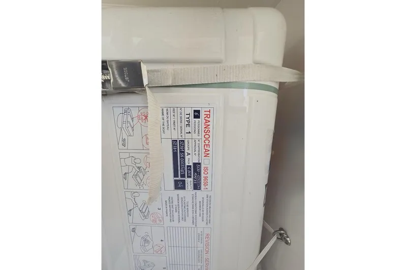 Honu Kai Yacht Photos Pics Liferaft container on 2023 Fountaine Pajot Catamaran Astrea 42, labeled "Transocean ISO 9650-1".