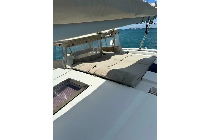 Honu Kai Yacht Photos Pics 2023 Fountaine Pajot Catamaran Astrea 42 deck with sunbed and ocean view.