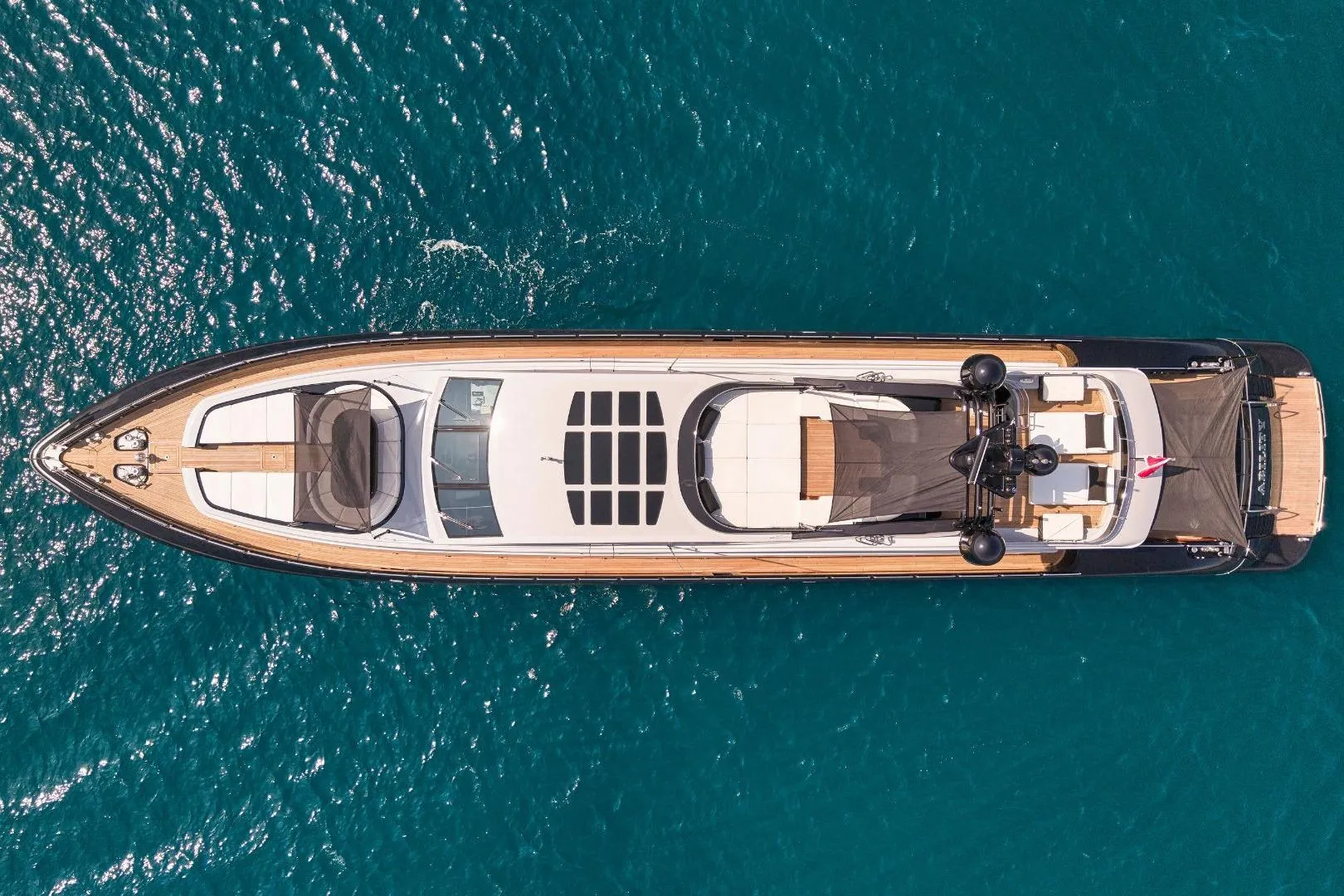 Aerial view of 2007 Codecasa 41 S yacht on clear blue water.